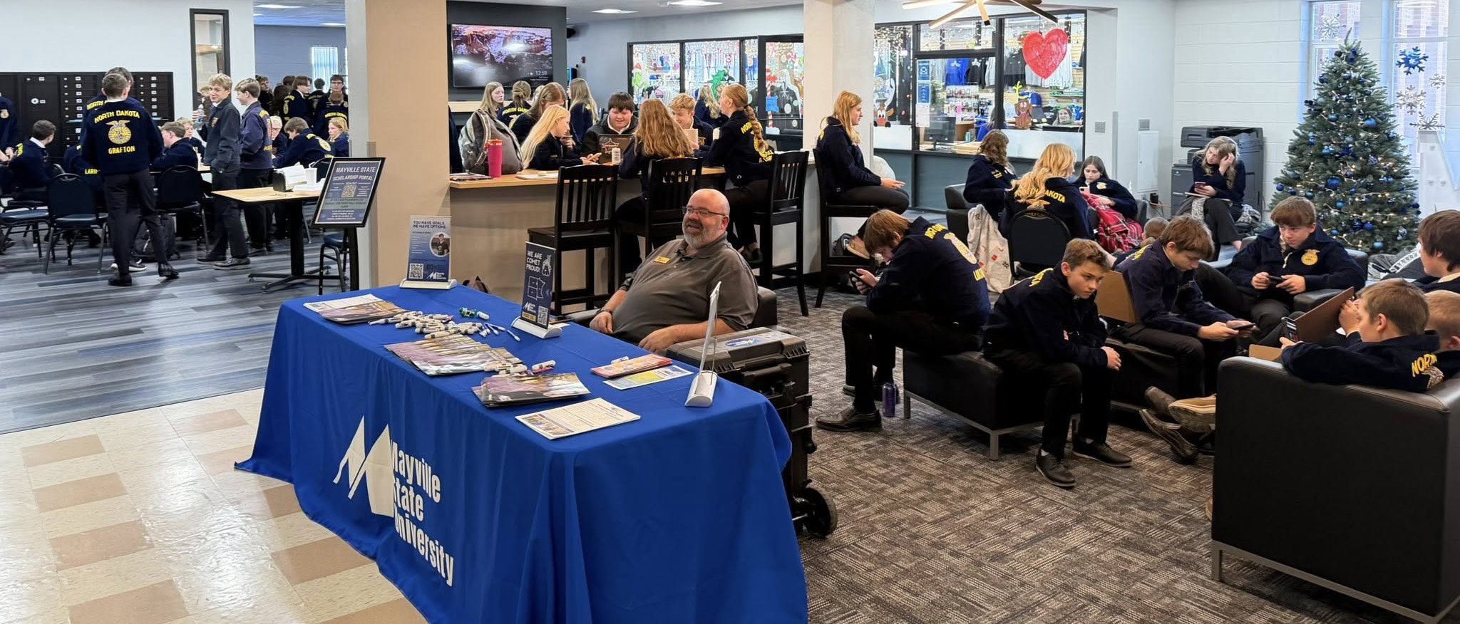 Jim Morowski at Mayville State table.jpg